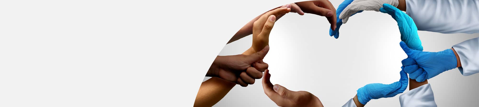 Medical staff forming outline of human heads with hands